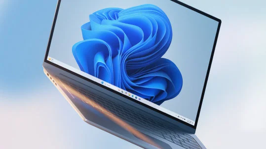 윈도우 11 기본 배경 화면과 작업 표시줄이 보이는 노트북, Microsoft 윈도우 11 공식 페이지 이미지